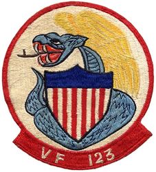 Fighter Squadron 123 (VF-123)
Established as Fighter Squadron EIGHT SEVEN THREE (VF-871) in 1949 and called to active duty on 20 Jul 1950. Redesignated Fighter Squadron ONE TWO THREE (VF-123) “Blue Racers” on 4 Feb 1953, Fighter Squadron FIVE THREE (VF-53) on 15 Apr 1958; Fighter Squadron ONE FORTY THREE (VF-143) (2nd) on 20 Jun 1963.

Grumman F9F-2 Panther, 1953-1954
Grumman F9F-6/8 Cougar, 1954-1958

Insignia (2nd version) slightly modified in 1955.


