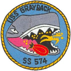 SS-574 USS Grayback
Namesake. The gray whale, (Eschrichtius robustus), the sole living species in the genus Eschrichtius
Ordered. 10 Mar 1951
Builder. Mare Island Naval Shipyard, CA
Laid down. 1 Jul 1954
Launched. 2 Jul 1957
Commissioned. 7 Mar 1958, as SSG-574
Decommissioned. 25 May 1964
Recommissioned. 9 May 1969, as LPSS-574
Decommissioned. 15 Jan 1984
Stricken	. 16 Jan 1984
Homeport. Pearl Harbor, HI
Motto. De Profundis Futurus
Fate. Sunk as a target near Subic Bay, 13 Apr 1986
Class and type. Grayback-class submarine
Displacement:	
1,740 long tons (1,768 t) light
2,768 long tons (2,812 t) full
Length. 273 ft (83 m) later extended to 317 ft 7 in (96.80 m)
Beam. 27 ft 2 in (8.28 m)
Draft. 19 ft (5.8 m)
Propulsion. 3 Fairbanks-Morse Diesel engines, 2 Elliott electric motors
Speed. 15 knots (28 km/h; 17 mph) surfaced; 12 knots (22 km/h; 14 mph) submerged
Complement. 84 officers and men
Armament:	
2 × Regulus missile hangars (4 x Regulus I missiles or 2 x Regulus II missiles)
8 × 21 inch (533 mm) torpedo tubes (6 bow, 2 stern)

