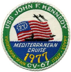 CV-67 USS John F Kennedy MEDITERRANEAN CRUISE 1977
Namesake. John F Kennedy, (1917-1963), 35th president of the USA
Awarded. 30 Apr 1964
Builder. Newport News Shipbuilding, VA
Laid down. 22 Oct 1964
Launched. 27 May 1967
Christened. 27 May 1967
Commissioned. 7 Sep 1968
Decommissioned. 23 Mar 2007
Stricken. 16 Oct 2009
Fate. Sold to International Shipbreaking Limited on 6 Oct 2021 to be dismantled 
Motto Date Nolite Rogare (Give, do not ask)
Type. variant of the Kitty Hawk class aircraft carrier
Displacement:	
60,728 tons light
82,655 tons full load
21,927 tons deadweight
Length. 1,052 ft (321 m) overall, 990 ft (300 m) waterline
Beam. 252 ft (77 m) extreme, 130 ft (40 m) waterline
Height. 192 ft (59 m) from top of the mast to the waterline
Draft. 36 ft (11 m) maximum, 37 ft (11 m) limit
Installed power. 8 Ã— Babcock & Wilcox boilers, 1,200 PSI 280,000 shp (210 MW)
Propulsion:	
4 Ã— steam turbines
4 shafts
Speed	34 knots (63 km/h; 39 mph)
Capacity. 5,000+
Complement. 3,297 officers and men (without jet commands & crews)
Armament:	
2 Ã— GMLS Mk 29 launchers for Sea Sparrow missiles
2 Ã— Phalanx CIWS
2 Ã— RAM launchers
Aircraft carried. 	80+

