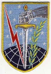 12th Bombardment Squadron, Medium
Emblem Significance: Our emblem symbolizes our Squadron's mission and our relationship to the Strategic Air Command. A mailed fist holding a downward pointed broadsword symbolizes the force and preparedness of a unit possessing striking power. The mailed fist and lightning bolt as well as the olive branch are from the emblem of the Strategic Air Command and signify power and striking potential while maintaining the peace. The element of the grid-lined globe notes the world-wide capability of the unit while the upper portion of the field of the shield contains the star-encrusted blue of the SAC banner. Emblem approved 5 August 1957. (Source: AFHRA Records) 
