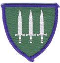 NATO_3_swords_on_green_shield.jpg