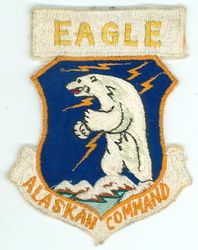 Alaskan Command
As a unified command, Alaskan Command was active from 1 Jan 1947 - 30 Jun 1975.  It was reestablished as a subordinate unified command under USSPACECOM on 7 Jul 1989 and subsequently transitioned to other commands after USSPACECOM was inactivated.  ("Eagle" probably refers to either the ALCOM commander or the callsign of his aircraft.) -GWO 
