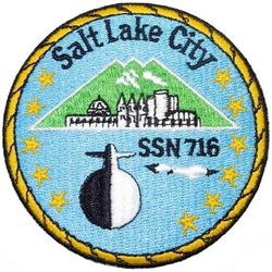 SSN-716 USS Salt Lake City 
Namesake. Salt Lake City, UT
Ordered. 15 Sep 1977
Builder. Newport News Shipbuilding and Dry Dock Company
Laid down. 26 Aug 1980
Launched. 16 Oct 1982
Commissioned. 12 May 1984
Decommissioned. 15 Jan 2006
Stricken	. 15 Jan 2006
Fate. Stricken, to be disposed of by submarine recycling
Class and type. Los Angeles-class submarine
Displacement:	
5,763 long tons (5,855 t) surfaced
6,130 long tons (6,228 t) submerged
6,136,730 long tons (6,235,206 t) dead
Length. 362 ft (110.3 m)
Beam. 33 ft (10 m)
Draft. 32 ft (9.8 m)
Propulsion. S6G reactor
Complement. 12 officers, 98 men
Sensors and processing systems	BQQ-5 passive sonar, BQS-15 detecting and ranging sonar, WLR-8 fire control radar receiver, WLR-9 acoustic receiver for detection of active search sonar and acoustic homing torpedoes, BRD-7 radio direction finder
Armament: 
4 × 21 in (533 mm) bow tubes, 10 Mk48 ADCAP torpedo reloads
Tomahawk land attack missile block 3 SLCM range 1,700 nautical miles (3,100 km)
Harpoon anti–surface ship missile range 70 nautical miles (130 km)
mine laying Mk67 mobile Mk60 captor mines

