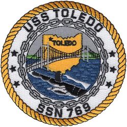 SSN-769 USS Toledo
Namesake. The City of Toledo, OH
Awarded. 10 Jun 1988
Builder. Newport News Shipbuilding and Drydock Company
Laid down. 6 May 1991
Launched. 28 Aug 1993
Sponsored by. Mrs. Sabra Smith
Commissioned. 24 Feb 1995
Motto. "Forged from Metal, Prepared for Battle"
Class and type. Los Angeles-class submarine
Displacement:
6,000 long tons. (6,096 t) light
6,927 long tons. (7,038 t) full
927 long tons. (942 t) dead
Length. 110.3 m (361 ft 11 in)
Beam. 10 m (32 ft 10 in)
Draft. 9.4 m (30 ft 10 in)
Propulsion:
1 × S6G PWR nuclear reactor with D2W core (165 MW), HEU 93.5%
2 × steam turbines (33,500) shp
1 × shaft
1 × secondary propulsion motor 325 hp (242 kW)
Complement 12 officers, 98 men
Armament:
4 × 21 in (533 mm) torpedo tubes
12 × vertical launch Tomahawk missiles
