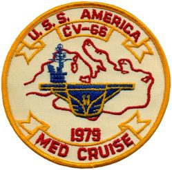 CV-66 USS America MEDITERRANEAN CRUISE 1979
Namesake. United States of America
Ordered. 25 Nov 1960
Builder. Newport News Shipbuilding, VA
Laid down. 9 Jan 1961
Launched. 1 Feb 1964
Commissioned. 23 Jan 1965
Decommissioned. 9 Aug 1996
Reclassified. CV-66, 30 Jun 1975
Stricken	.  Aug 1996
Homeport. Norfolk, VA
Motto. Don't Tread on Me
Fate. Scuttled after live-fire testing 14 May 2005
Class and type. Kitty Hawk-class aircraft carrier
Displacement. 61,174 long tons (62,156 t) (light), 83,573 long tons (84,914 t) (full load)
Length. 990 ft (300 m) (waterline), 1,048 ft (319 m) overall
Beam. 248 ft (76 m) extreme, 129 ft (39 m) waterline
Draft. 38 ft (12 m) (maximum), 37 ft (11 m) (limit)
Installed power. 280,000 hp (210 MW)
Propulsion:	
4 × steam turbines
8 × boilers
4 × shafts
Speed. 34 kn (39 mph; 63 km/h)
Complement. 502 officers, 4684 men
Sensors and processing systems:	
AN/SPS-49
AN/SPS-48
Electronic warfare & decoys. AN/SLQ-32
Armament:	
Terrier missile (replaced with Sea Sparrow)
Phalanx CIWS
Aircraft carried. 	about 79

