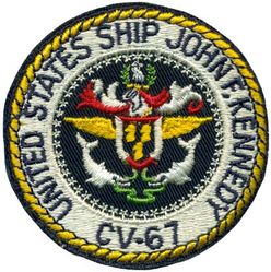 CV-67 USS John F Kennedy 
Namesake. John F Kennedy, (1917-1963), 35th president of the USA
Awarded. 30 Apr 1964
Builder. Newport News Shipbuilding, VA
Laid down. 22 Oct 1964
Launched. 27 May 1967
Christened. 27 May 1967
Commissioned. 7 Sep 1968
Decommissioned. 23 Mar 2007
Stricken. 16 Oct 2009
Fate. Sold to International Shipbreaking Limited on 6 Oct 2021 to be dismantled 
Motto Date Nolite Rogare (Give, do not ask)
Type. variant of the Kitty Hawk class aircraft carrier
Displacement:	
60,728 tons light
82,655 tons full load
21,927 tons deadweight
Length. 1,052 ft (321 m) overall, 990 ft (300 m) waterline
Beam. 252 ft (77 m) extreme, 130 ft (40 m) waterline
Height. 192 ft (59 m) from top of the mast to the waterline
Draft. 36 ft (11 m) maximum, 37 ft (11 m) limit
Installed power. 8 × Babcock & Wilcox boilers, 1,200 PSI 280,000 shp (210 MW)
Propulsion:	
4 × steam turbines
4 shafts
Speed	34 knots (63 km/h; 39 mph)
Capacity. 5,000+
Complement. 3,297 officers and men (without jet commands & crews)
Armament:	
2 × GMLS Mk 29 launchers for Sea Sparrow missiles
2 × Phalanx CIWS
2 × RAM launchers
Aircraft carried. 	80+

