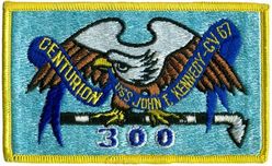 CV-67 USS John F Kennedy 300 Carrier Landings
Namesake. John F Kennedy, (1917-1963), 35th president of the USA
Awarded. 30 Apr 1964
Builder. Newport News Shipbuilding, VA
Laid down. 22 Oct 1964
Launched. 27 May 1967
Christened. 27 May 1967
Commissioned. 7 Sep 1968
Decommissioned. 23 Mar 2007
Stricken. 16 Oct 2009
Fate. Sold to International Shipbreaking Limited on 6 Oct 2021 to be dismantled 
Motto Date Nolite Rogare (Give, do not ask)
Type. variant of the Kitty Hawk class aircraft carrier
Displacement:	
60,728 tons light
82,655 tons full load
21,927 tons deadweight
Length. 1,052 ft (321 m) overall, 990 ft (300 m) waterline
Beam. 252 ft (77 m) extreme, 130 ft (40 m) waterline
Height. 192 ft (59 m) from top of the mast to the waterline
Draft. 36 ft (11 m) maximum, 37 ft (11 m) limit
Installed power. 8 × Babcock & Wilcox boilers, 1,200 PSI 280,000 shp (210 MW)
Propulsion:	
4 × steam turbines
4 shafts
Speed	34 knots (63 km/h; 39 mph)
Capacity. 5,000+
Complement. 3,297 officers and men (without jet commands & crews)
Armament:	
2 × GMLS Mk 29 launchers for Sea Sparrow missiles
2 × Phalanx CIWS
2 × RAM launchers
Aircraft carried. 	80+

