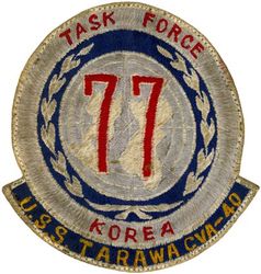 CVA-40 USS Tarawa WESTERN PACIFIC CRUISE 1953-1954
Namesake. Battle of Tarawa, was fought on 20-23 Nov 1943 at the Tarawa Atoll in the Gilbert Islands, and was part of Operation Galvanic, the U.S. invasion of the Gilberts
Builder. Norfolk Naval Shipyard, VA
Laid down. 1 Mar 1944
Launched. 12 May 1945
Commissioned. 	8 Dec 1945
Decommissioned. 30 Jun 1949
Recommissioned. 3 Feb 1951
Decommissioned. 13 May 1960
Reclassified:	
CVA-40, 1 Oct 1952
CVS-40, 10 Jan 1955
AVT-12, May 1961
Stricken. 1 Jun 1967
Fate. Scrapped, 3 Oct 1968
Class and type. Essex-class aircraft carrier
Displacement. 27,100 long tons (27,500 t) standard
Length. 888 feet (271 m) overall
Beam. 93 feet (28 m)
Draft. 28 feet 7 inches (8.71 m)
Installed power. 8 × boilers, 150,000 shp (110 MW)
Propulsion:	
4 × geared steam turbines
4 × shafts
Speed. 33 knots (61 km/h; 38 mph)
Complement. 3448 officers and enlisted
Armament:	
12 × 5 inch (127 mm)/38 caliber guns
32 × Bofors 40 mm guns
46 × Oerlikon 20 mm cannons
Armor:Belt: 4 in, Hangar deck: 2.5 in, Deck: 1.5 in, Conning tower: 1.5 inch
Aircraft carried. 90–100 aircraft

