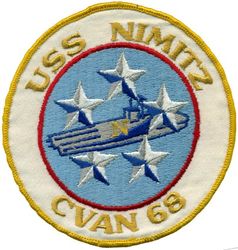 CVAN-68 USS Nimitz 
Namesake. Chester W Nimitz, (1885-1966), fleet admiral in the USN, WW-II Commander in Chief, US Pacific Fleet, Commander in Chief, Pacific Ocean Areas during World War II.
Ordered. 31 Mar 1967
Builder. Newport News Shipbuilding, VA
Laid down. 22 Jun 1968
Launched. 13 May 1972
Commissioned. 3 May 1975
Reclassified. CVN-68, 30 Jun 1975
Homeport. NB Kitsap, WA
Motto. Teamwork, a Tradition
Class and type. Nimitz-class aircraft carrier
Displacement. 100,020 long tons (112,020 short tons)
Length:	
Overall: 1,092 feet (332.8 m)
Waterline: 1,040 feet (317.0 m)
Beam:	
Overall: 252 ft (76.8 m)
Waterline: 134 ft (40.8 m)
Draft:	
Maximum navigational: 37 feet (11.3 m)
Limit: 41 feet (12.5 m)
Propulsion:	
2 × Westinghouse A4W nuclear reactors (HEU 93.5%)
4 × steam turbines
4 × shafts
260,000 shp (194 MW)
Speed. 31.5 knots (58.3 km/h; 36.2 mph)
Range. Unlimited distance; 20–25 years
Complement. Ship's company: 3,532, Air wing: 2,480
Sensors and processing systems:
AN/SPS-48E 3-D air search radar
AN/SPS-49(V)5 2-D air search radar
AN/SPQ-9B target acquisition radar
AN/SPN-46 air traffic control radars
AN/SPN-43C air traffic control radar
AN/SPN-41 landing aid radars
4 × Mk 91 NSSM guidance systems
4 × Mk 95 radars
Electronic warfare & decoys:	
AN/SLQ-32A(V)4 Countermeasures suite
SLQ-25A Nixie Torpedo Countermeasures
Armament:	
2 × Sea Sparrow
2 × RIM-116 Rolling Airframe Missile
2 × PHALANX CIWS (Close-In Weapons System) Gatling guns
4 × MK 38 25mm autocannon turrets
10 × .50 cal turret emplacements
Armor. Unknown
Aircraft carried. 90 fixed wing and helicopters

