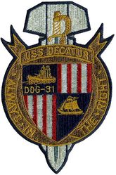 DDG-31 USS Decatur
Name. USS Decatur (DD-936 - DDG-31)
Namesake. Stephen Decatur
Builder. Bethlehem Steel Corporation, Fore River Shipyard, Quincy, Massachusetts
Laid down. 13 Sep 1954
Launched. 15 Dec 1955
Acquired. 30 Nov 1956
Commissioned. 7 Dec 1956
Decommissioned. 30 Jun 1983
Stricken	. 16 Mar 1988
Fate. Disposed of in support of Fleet training exercise, 22 Jul 2004
Class and type. Forrest Sherman-class destroyer
Displacement. 4,050 tons
Length. 418 ft 6 in (128 m)
Beam. 45 ft (13.7 m)
Draught. 19 ft 6 in (5.9 m)
Propulsion. 70,000 shp (52.2 MW); Geared turbines, two propellers
Speed. 33 knots (61 km/h; 38 mph)
Range. 4500 nautical miles (8,300 km)
Complement. 337
Electronic warfare & decoys. 5
Armament:
(1956)
3 × 5 in (127 mm)/54,
2 × 3 in (76 mm)/50 twin mounts,
2 × ASW hedgehogs (Mk 11),
4 × 21 inch (533 mm) Mk 25 torpedo tubes
(1967)
2 × 5 in (127 mm)/54,
1 × ASROC launcher
2 × triple 13 in Mk 32 torpedo tubes

