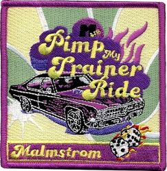 Class 2005-06 Minuteman III Initial Qualification Training
Pimp My Ride was an American television series produced by and aired on MTV for six seasons from 2004 to 2007.  This patch displays a slightly modified version of the logo for that show, which is predominately a tricked-out sedan with hood scoop and side flames.  The MTV logo that appeared above "Pimp" has been changed from a large "M" with small "TV" on one of its legs to a large "M" with small "AFB."  Much more obvious is insertion of the word "Trainer" in the title and display of "Malmstrom" in the rectangular box at the bottom.  The dice include the class number. This was the morale patch, worn in addition to their “Official” class patch.
