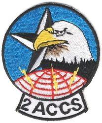 2d Airborne Command and Control Squadron
Significance submitted by unit: In the center of the emblem is a five-pointed star signifying the Joint Chiefs of Staff under whose purview all military organizations function. Only three points of the star are viewed, symbolizing the TRIAD -- the three arms of our deterrent nuclear force. Superimposed on the star is the head of an eagle, strong in visage, doubly symbolic of our nation's freedom, power, and vision as well as our squadron's flying mission. The eagle is poised above a globe which is indicative of the worldwide nature of our mission. Emanating from the globe, rising into the sky are three communications sparks symbolizing our squadron's function, denoting our role of command, control, and communication.

 Because of McPeak's directive limiting the number of elements organizational emblems could contain, the star and flashes were omitted from the approved emblem. Nevertheless, the unit ordered its patches WITH the star and "sparks" and none were ever made without these elements.

 Approved Significance: Blue and yellow are the Air Force colors. Blue alludes to the sky, the primary theater of Air Force operations. Yellow refers to the sun and the excellence required of Air Force personnel. The eagle is symbolic of the unit's flying mission and reflects its commitment to defense of freedom anywhere in the world, as reflected by the globe. (Approved 19 July 1993) 

 The pictured patch was the first version worn, but not by everyone. Pending receipt of the patches that were ordered "through the system," a unit member who went TDY to the far east had a small quantity of these made for wear on an interim basis. 

