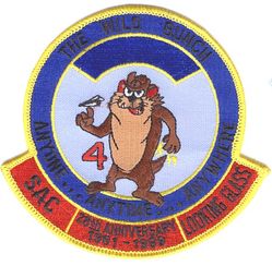 2d Airborne Command and Control Squadron Airborne Launch Control System LOOKING GLASS 28th Anniversary Reject
This version of the patch was rejected by the unit because all of the words were in black, making everything extremely difficult to see and read. (See description of the similar version with white lettering) 
Keywords: Tasmanian Devil