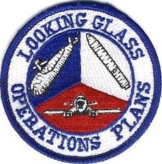 2d Airborne Command and Control Squadron Operations Plans
2 ACCS/DOCX Functional patch created ca. 1991 and based upon a design by Lt Cols Ken Hurt and Ray Watts, and Majs Mike Wise and Bob Trummer. It depicts the three legs of the nuclear Triad. It was worn on the left shoulder by the Single Integrated Operational Plan (SIOP) Advisors on the battlestaff who led the Planning Team (Intel, Logistics, and sometimes Weather and Engineering, officers). 
