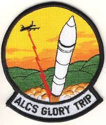 2d Airborne Command and Control Squadron Glory Trip
Designed in 1993 by Maj Greg Ogletree for Missile Combat Crew Members--Airborne who directly participate in the test launch of an ICBM commanded from an ALCS-equipped aircraft. Direct participation in an ALCS Glory Trip was denoted by the addition of a silver star device for each such mission. A gold star was worn in lieu of a silver star if the wearer actually "turned keys" (i.e., launched the missile) on the mission. This design was intentionally generic because the typical ALCS crew member participated in a number of such missions, whereas very few ground-based missileers are ever selected for a Glory Trip and of those who are, it's a one-time good deal (ergo, a unique patch for each launch). This patch subsequently proved popular with 7 ACCS aircrews too, after the 2 ACCS inactivated. 
